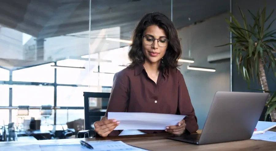 A woman completes her work efficiently thanks to hospital revenue cycle analytic software.